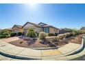 Single-story home boasting desert landscaping, well-maintained facade, and inviting curb appeal on a sunny day at 6059 Saddle Horse Ave, Las Vegas, NV 89122