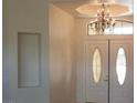 Elegant foyer featuring decorative double doors and a decorative chandelier at 6120 Matisse Ave, Las Vegas, NV 89131