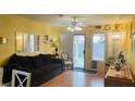 Bright living room with natural light, neutral decor, and a sliding glass door to the backyard at 6445 Glory Rise Ct, Las Vegas, NV 89142