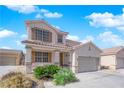 Charming two-story home featuring a spacious driveway and well-maintained front yard landscaping at 6817 Frances Celia Ave, Las Vegas, NV 89122