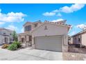 Lovely two-story home featuring a spacious driveway, attached two-car garage, and well-kept landscaping at 6817 Frances Celia Ave, Las Vegas, NV 89122