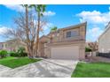 Charming two-story home with a well-maintained lawn and desert landscaping in a residential neighborhood at 7213 Buglehorn St, Las Vegas, NV 89131