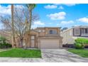 Charming two-story home with a well-maintained lawn and desert landscaping in a residential neighborhood at 7213 Buglehorn St, Las Vegas, NV 89131