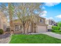 Charming two-story home with a well-maintained lawn and desert landscaping in a residential neighborhood at 7213 Buglehorn St, Las Vegas, NV 89131