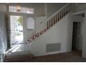 Bright entryway features tile flooring and a staircase leading to the second floor at 8332 Shore Breeze Dr, Las Vegas, NV 89128