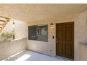 Cozy entryway features a window for natural light and a secure front door at 924 Falconhead Ln # 102, Las Vegas, NV 89128