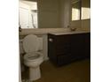 Functional bathroom with tiled floor, modern vanity and mirror, and toilet at 1405 S Nellis Blvd # 2087, Las Vegas, NV 89104