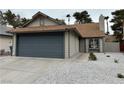 Charming single-story home with a two-car garage and well-maintained gravel landscaping at 163 Spinnaker Dr, Henderson, NV 89015