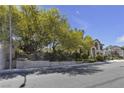 Two-story home with desert landscaping and an attached two car garage at 3047 Whispering Crest Dr, Henderson, NV 89052