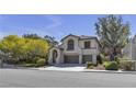 Desert home with low maintenance landscaping, two car garage, and an arched entry at 3047 Whispering Crest Dr, Henderson, NV 89052