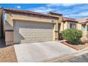 Attached two-car garage providing convenient parking and storage space to the home at 3335 Wasatch Cedars St, Las Vegas, NV 89122