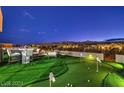 Rooftop deck with putting green, lounge chairs, and panoramic city views providing a luxurious outdoor space at 4077 Heron Fairway Dr, Las Vegas, NV 89141