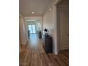 Elegant entryway with wood-look flooring, neutral paint and a stylish wood cabinet at 5051 Fairmont St, Pahrump, NV 89061