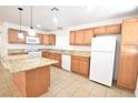 Bright and airy kitchen with granite countertops, island, and stainless steel appliances at 5087 Orinda Ave, Las Vegas, NV 89120