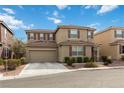 Charming two-story home featuring a tile roof, two car garage and landscaped front yard at 5967 Grechetto Ct, Las Vegas, NV 89141