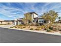 Beautiful two-story home with a three-car garage and mature landscaping at 6130 Pebble Glen, Las Vegas, NV 89149