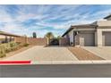 Three-car garage and block wall provide privacy and plenty of parking space at 6130 Pebble Glen, Las Vegas, NV 89149