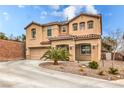 Beautiful two-story home featuring a lush front yard with desert landscaping at 6736 Sugarbird Ct, North Las Vegas, NV 89084