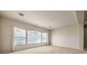 Spacious living room featuring a large window and neutral-toned walls at 6741 Philippe Allen Ave, Las Vegas, NV 89110