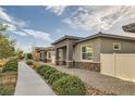 View of several homes featuring covered porches and low maintenance yards at 758 Marigold Sunrise St, Henderson, NV 89011