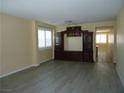 Comfortable living area with wood floors, a decorative cabinet, and ample space at 7929 Palace Monaco Ave, Las Vegas, NV 89117