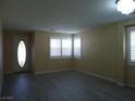 Inviting living room featuring wood floors, natural light, and neutral walls at 7929 Palace Monaco Ave, Las Vegas, NV 89117