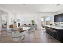 Open concept floor plan featuring modern living, dining, and kitchen area at 9032 Skye Canyon Ranch St, Las Vegas, NV 89166