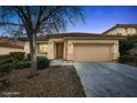 Inviting single-story house featuring a two-car garage and well-maintained landscaping at 11069 Crystal Crest Ct, Las Vegas, NV 89135