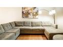 Spacious living room featuring a large sectional sofa, modern artwork, and a stylish floor lamp at 1390 Vegas Valley Dr # 30, Las Vegas, NV 89169