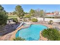 Aerial view of the backyard pool, spa, lush landscaping, and privacy at 1634 Georgia Ave, Boulder City, NV 89005