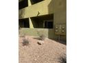 Apartment complex exterior featuring desert landscaping at 1842 N Decatur Blvd # 101, Las Vegas, NV 89108
