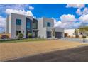 Modern home with desert landscaping, stylish gray exterior, and a convenient two-car garage at 2827 Richmar Ave, Henderson, NV 89074
