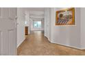 Inviting foyer with tile flooring, a decorative art piece, and a glimpse into the open living spaces at 2832 Goldcreek St, Henderson, NV 89052