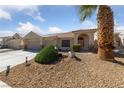 Attractive single-story home with mature landscaping and a three-car garage on a sunny day at 3561 Yorba Linda Dr, Las Vegas, NV 89122