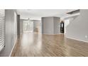 Bright open-concept living area with wood floors offers seamless flow at 3703 Laguna Veneta Ave, Las Vegas, NV 89141