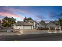 Charming single-Gathering home featuring a spacious driveway, two-car garage and manicured landscaping at 3710 E Oquendo Rd, Las Vegas, NV 89120