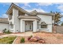 Stylish two-story home showcasing unique architectural features and well-manicured landscaping at 3710 E Oquendo Rd, Las Vegas, NV 89120