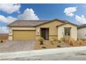 Charming single-story home featuring a two-car garage and desert landscaping at 4096 E Cactus Canyon Dr, Pahrump, NV 89061