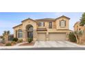 Charming two-story home with arched entry, stone accents, balcony, and a three-car garage at 4105 Falcons Flight Ave, North Las Vegas, NV 89084