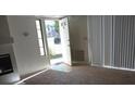 Neutral living room with an open doorway and a flood of natural light at 4865 S Torrey Pines Dr # 106, Las Vegas, NV 89103