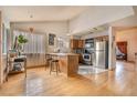 Cozy kitchen with stainless steel appliances, tile floors, and a breakfast bar at 5016 Roswell St, Las Vegas, NV 89120