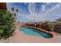Backyard pool featuring rock features, landscaping, and a view of the mountains at 5016 Roswell St, Las Vegas, NV 89120