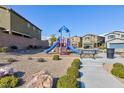 Community playground with play structure, benches, and desert landscaping at 5204 Sunstone Mesa Dr, Las Vegas, NV 89166