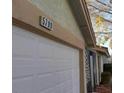 Close-up of the garage door with the house number; the garage is attached to the home at 5709 Goldmount Ave, Las Vegas, NV 89107