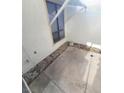 Private outdoor patio area with concrete flooring and privacy lattice for relaxing or entertaining at 5709 Goldmount Ave, Las Vegas, NV 89107