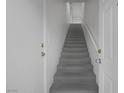 Bright staircase leading upstairs, featuring carpeted steps and white walls ready for decor at 6701 Dorita Ave # 202, Las Vegas, NV 89108