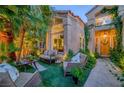 Inviting outdoor patio with comfortable seating, lush greenery, and a private, relaxing ambiance at 7889 Harbour Towne Ave, Las Vegas, NV 89113