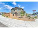 Two-story home featuring desert landscaping, and concrete sidewalk in front of the house at 8502 Torozo Ave, Las Vegas, NV 89149