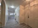 Inviting foyer with light gray plank flooring leads to an open living area at 9662 Allison Ranch Ave, Las Vegas, NV 89148