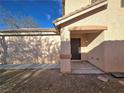 Close up of the front door with neutral paint and decorative stone features at 9662 Allison Ranch Ave, Las Vegas, NV 89148